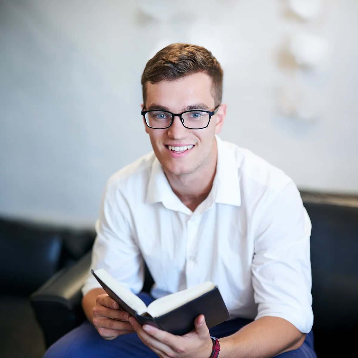 young pastor reading his BIble