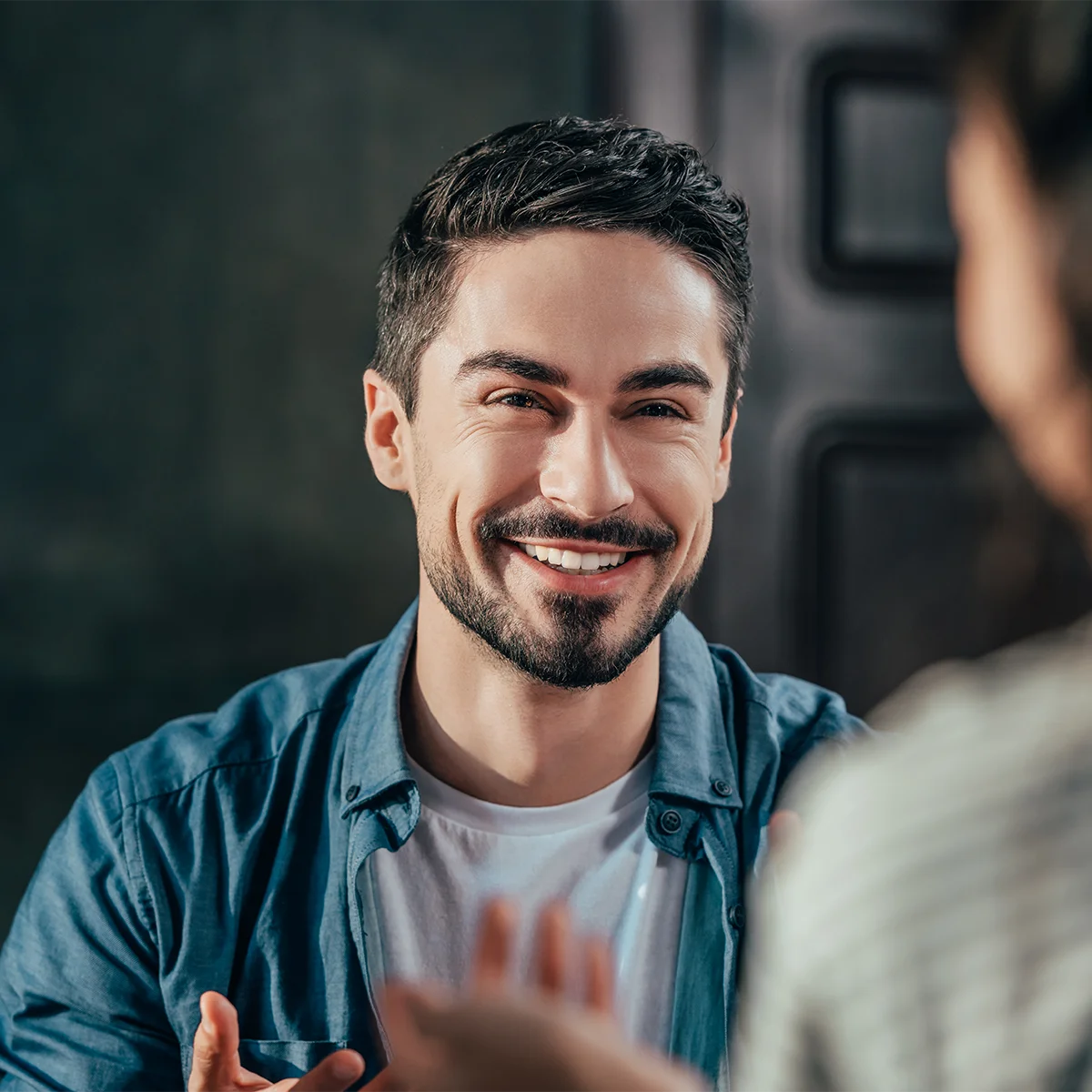 newly credentialed pastor talking with church member