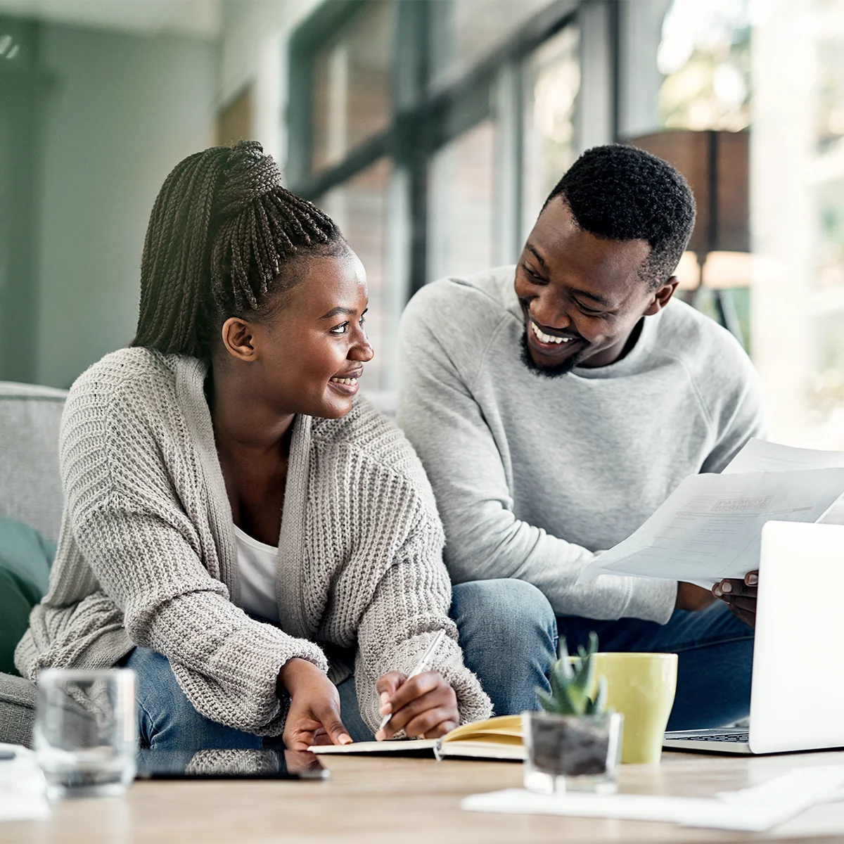couple utilizing financial calculators to calculate retirement financials