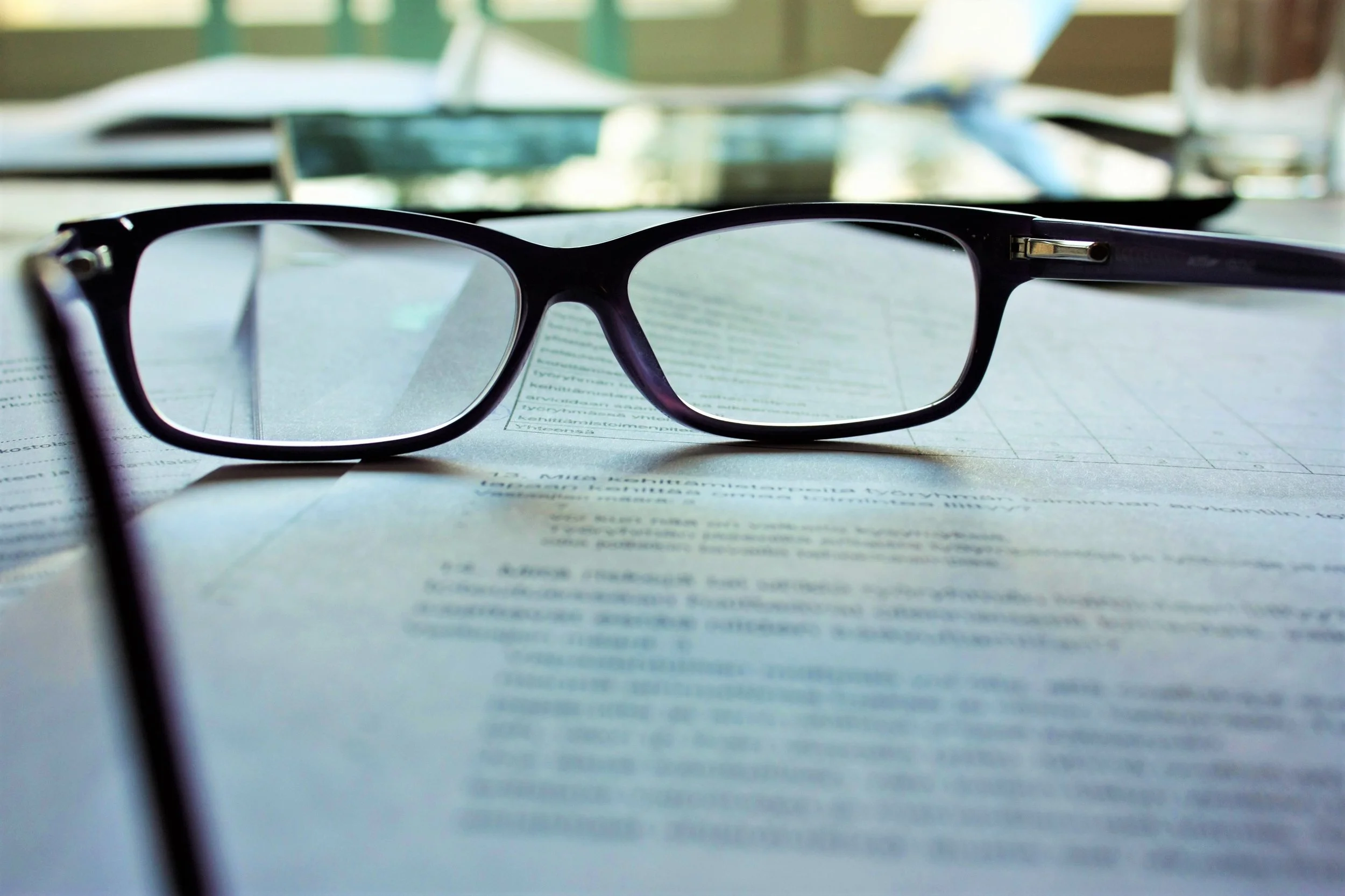 minister's glasses resting on documents