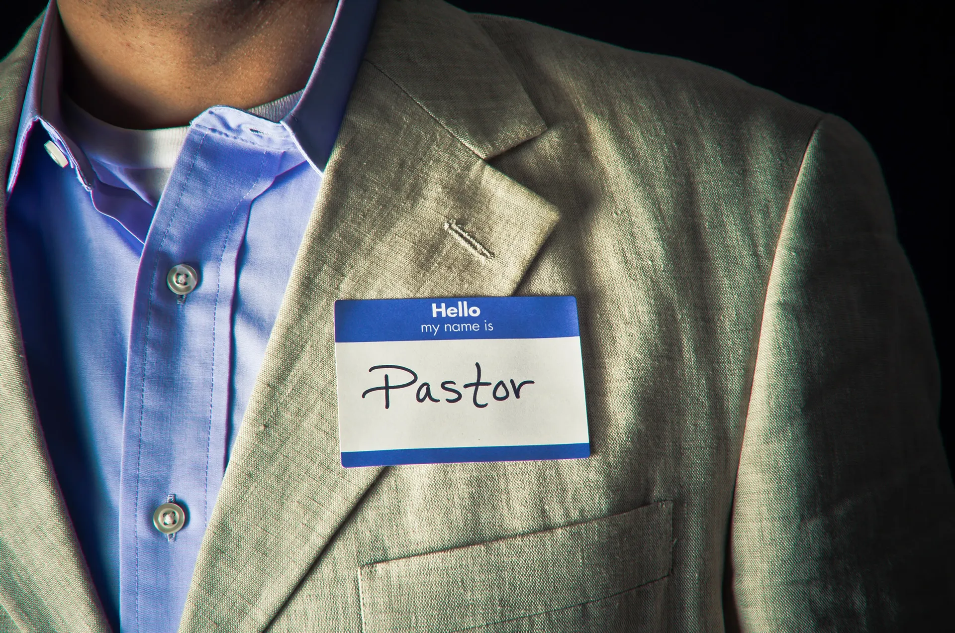 pastor with nametag