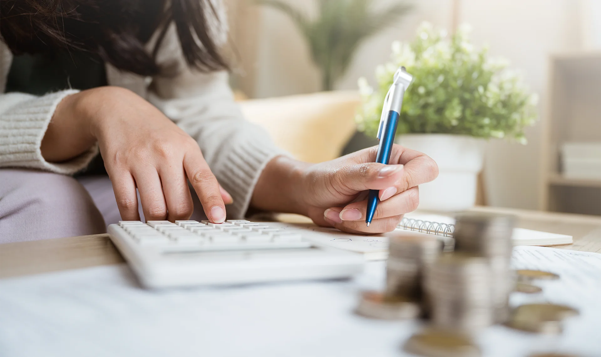 woman utilizing financial calculator for retirement planning