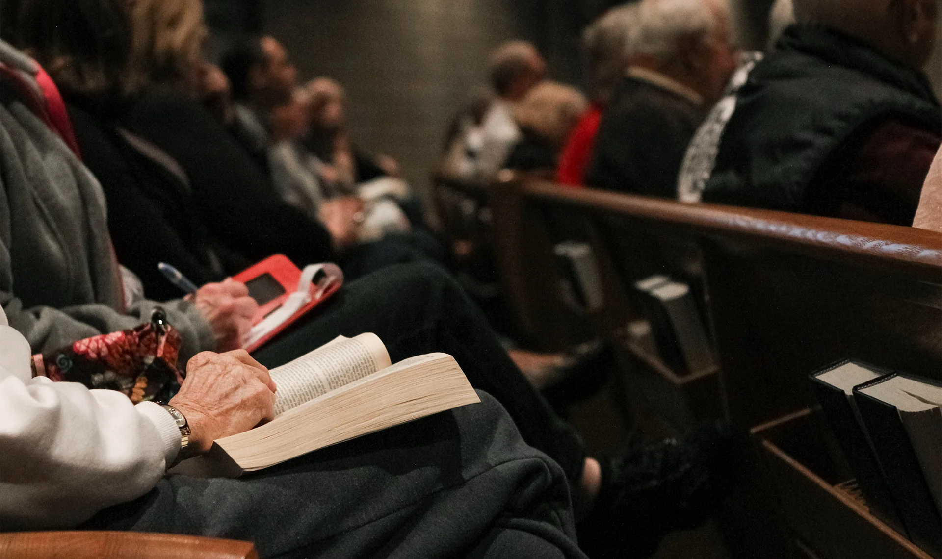 church members sitting in pews listening to sermon