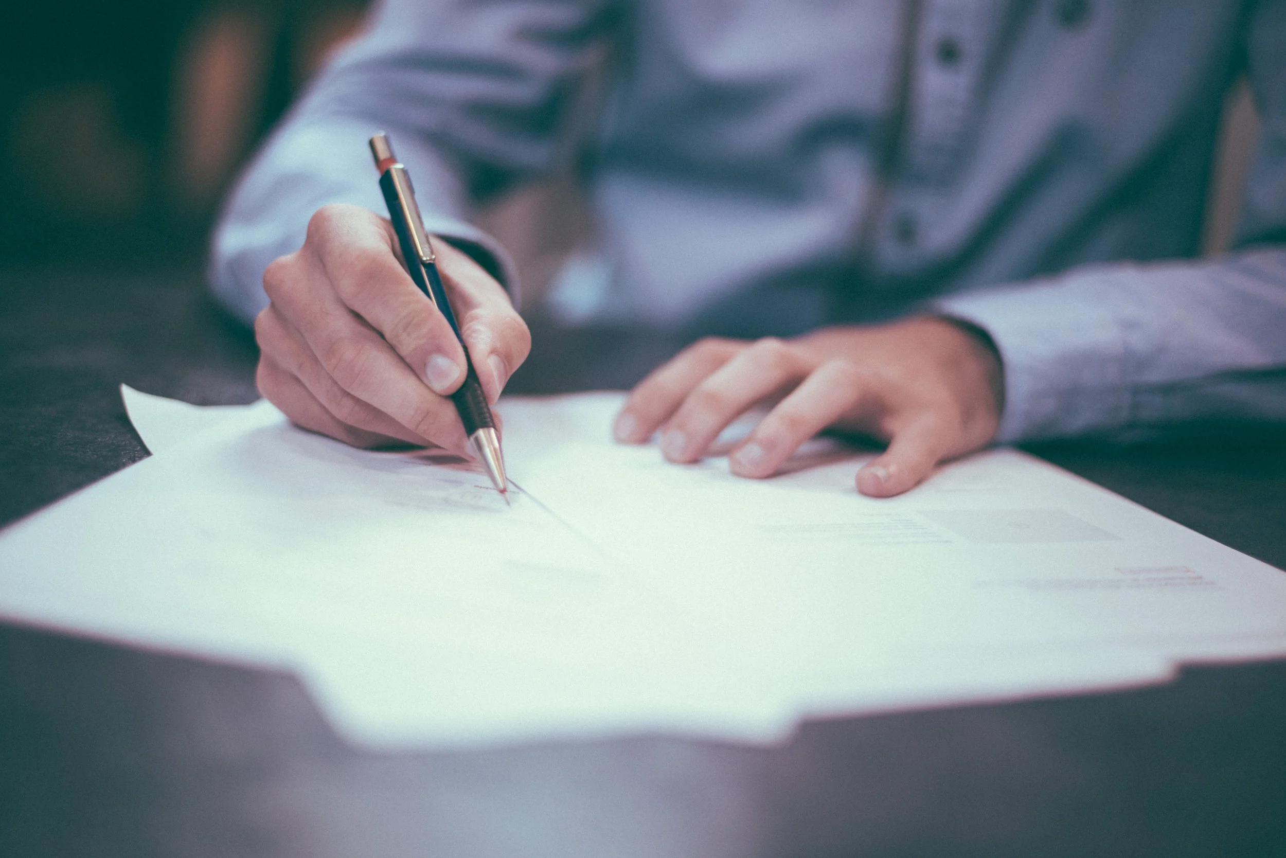 man filling out workers compensation paperwork
